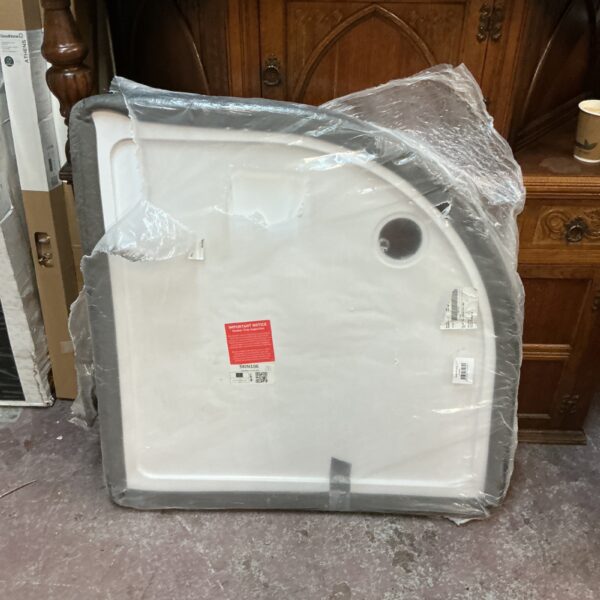 New white 900x900mm ceramic shower tray in packaging.