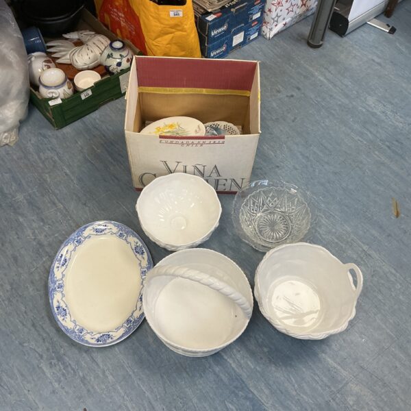 White porcelain baskets and plates in a vintage collection.