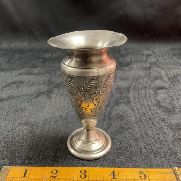 Antique whitemetal vase with detailed floral engraving, a beautiful collectible.