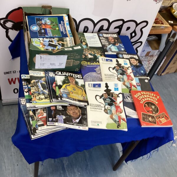 Large collection of vintage Wickham Wanderers football programs for collectors.