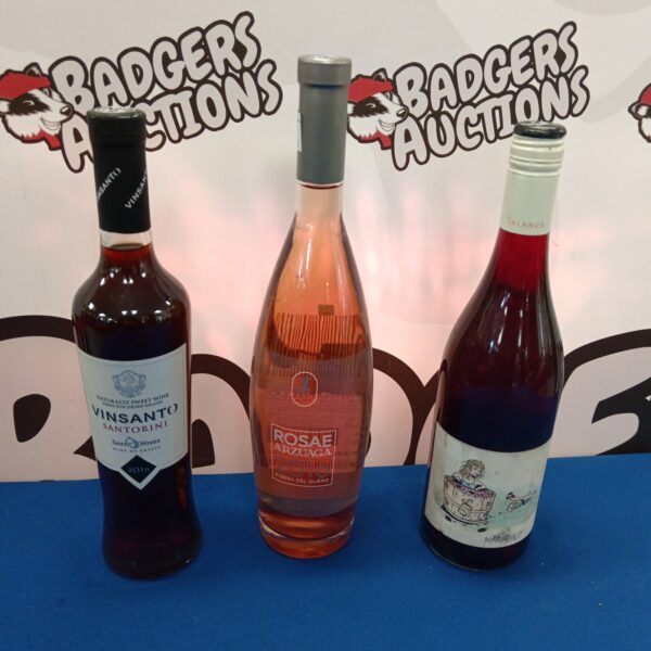 Wine collection featuring Rosae Arzuaga and Vinsanto Santorini bottles.