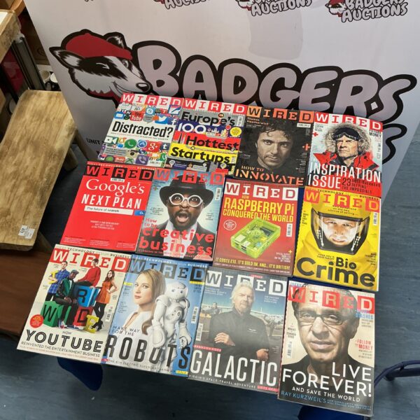 Lot of vintage Wired magazines focusing on technology and culture.