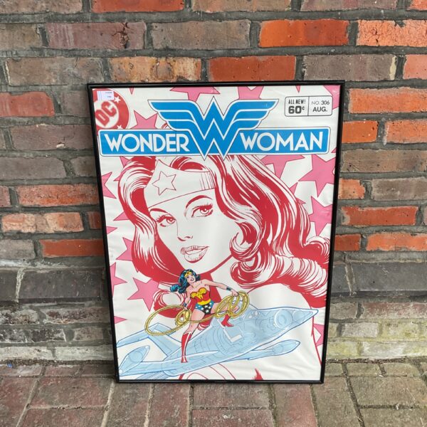 Framed vintage DC Comics Wonder Woman poster for collectors.