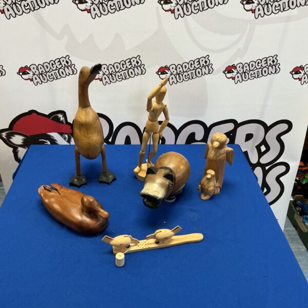 Hand-carved wooden animal collection with modelling manikin.