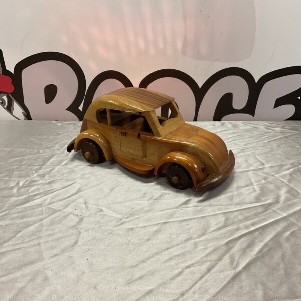 Detailed wooden Citroen 2CV model, vintage car collectible.