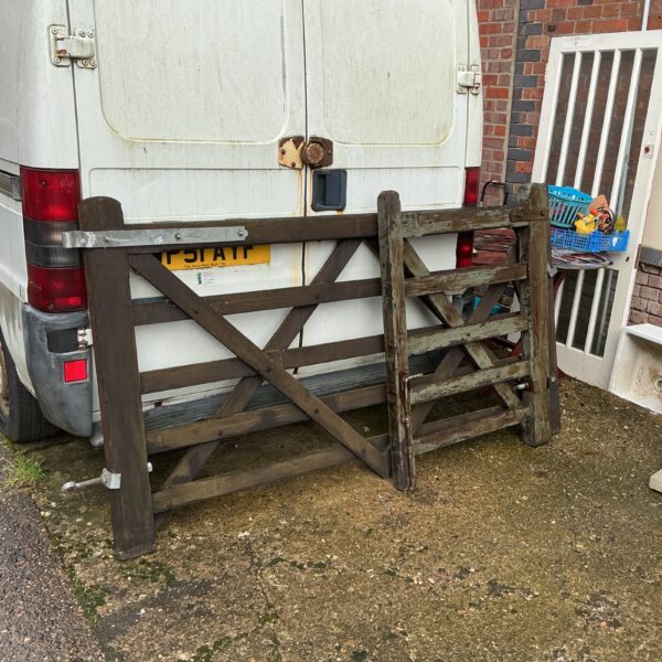 Pair of weathered wooden gates for garden or farm use.