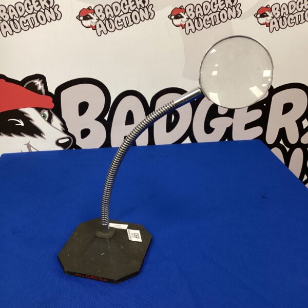 Adjustable workshop magnifying glass on a weighted base.