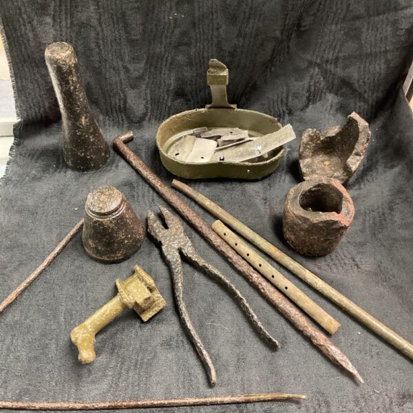 WWII German battlefield relics from France, a collection of corroded metal fragments.