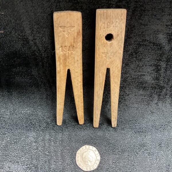 Vintage WWII Luftwaffe clothes pegs with German eagle marking.