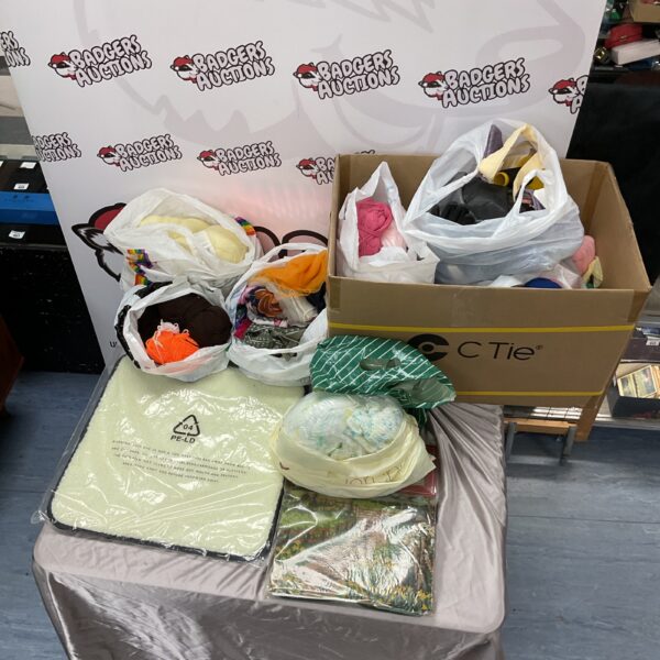 Overview of a large yarn and craft lot with fleece pad.