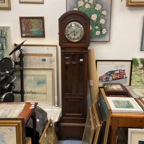 Vintage 1930s art deco grandfather clock with pendulum.