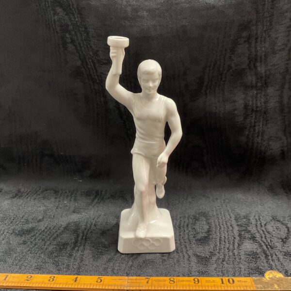 Vintage 1936 Berlin Olympic torchbearer statue, front view.