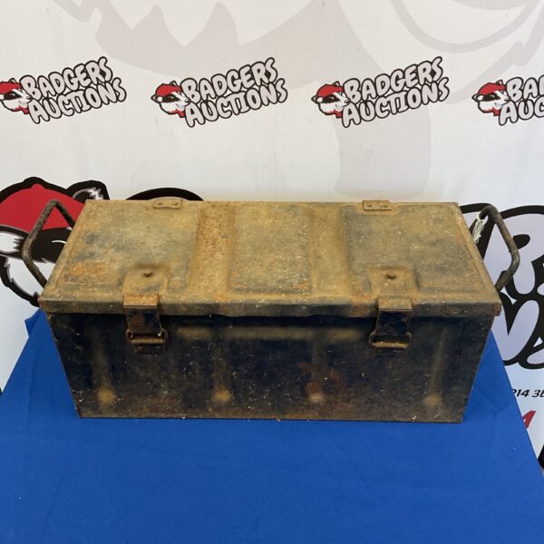 Vintage 1943 military ammo crate with rusted metal finish.