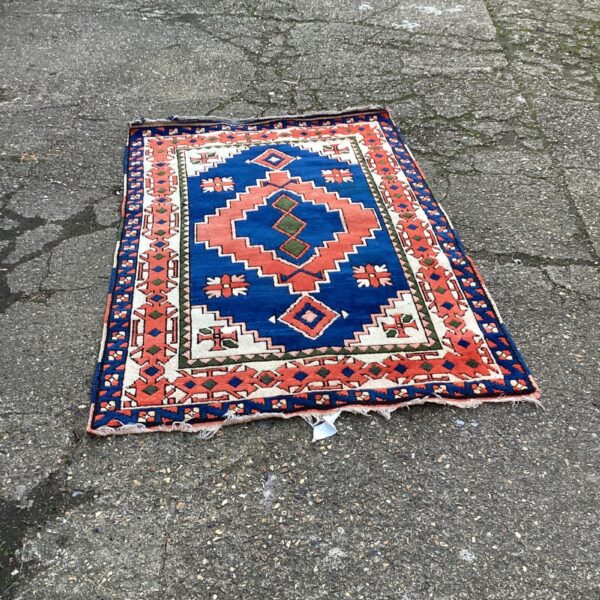 Vintage 19th-century handwoven Caucasian Kazak rug with geometric design.