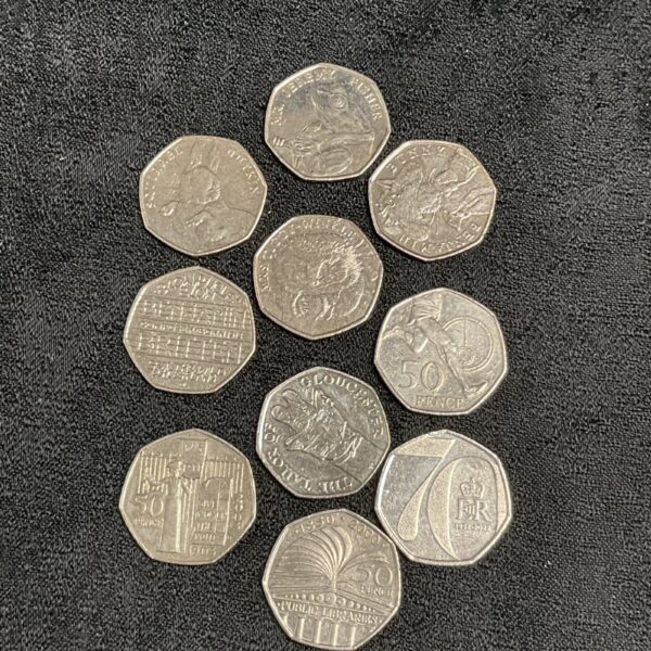 Collection of 50p coins including Beatrix Potter designs.