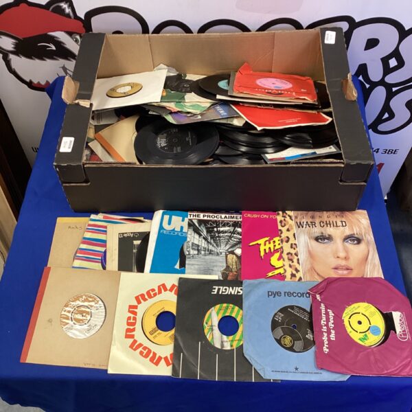 Vintage 7” vinyl records collection featuring Blondie and Steelers Wheel singles.