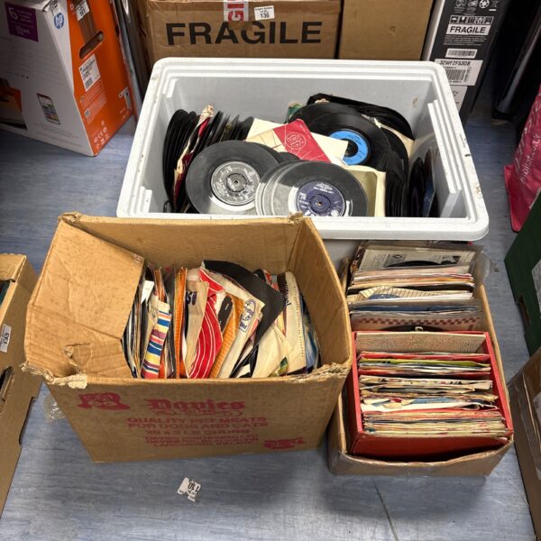 Vintage 7 inch vinyl singles lot in cardboard boxes.