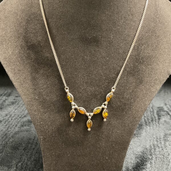Vintage 925 silver necklace with oval amber gemstones.