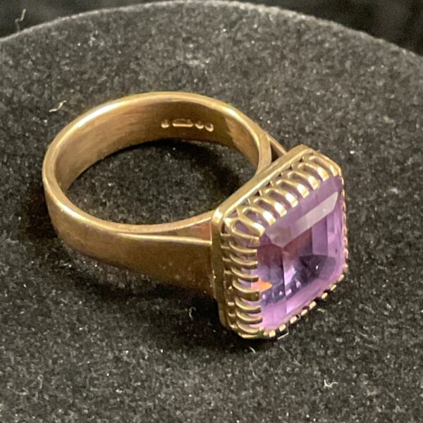 9ct gold gents ring with a square cut amethyst stone.