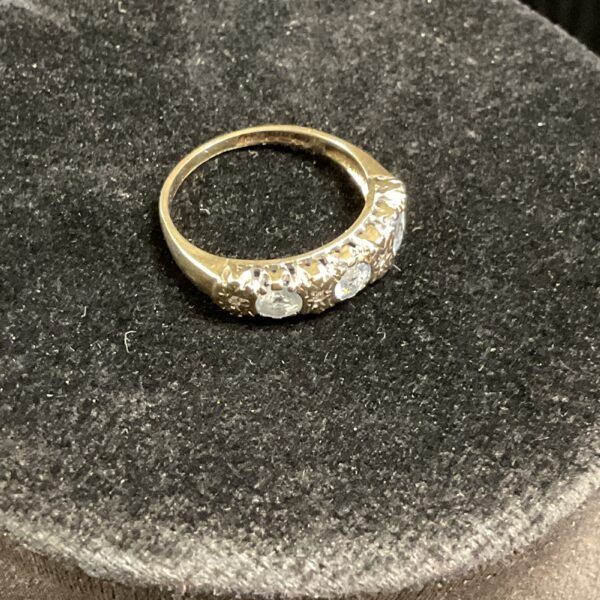 Elegant 9ct gold ring with three vibrant topaz stones.