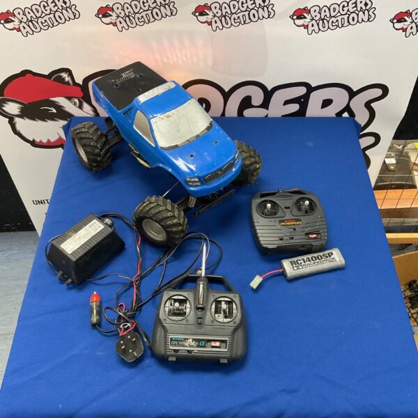Vintage Acoms Tamiya remote control truck with remote and charger.