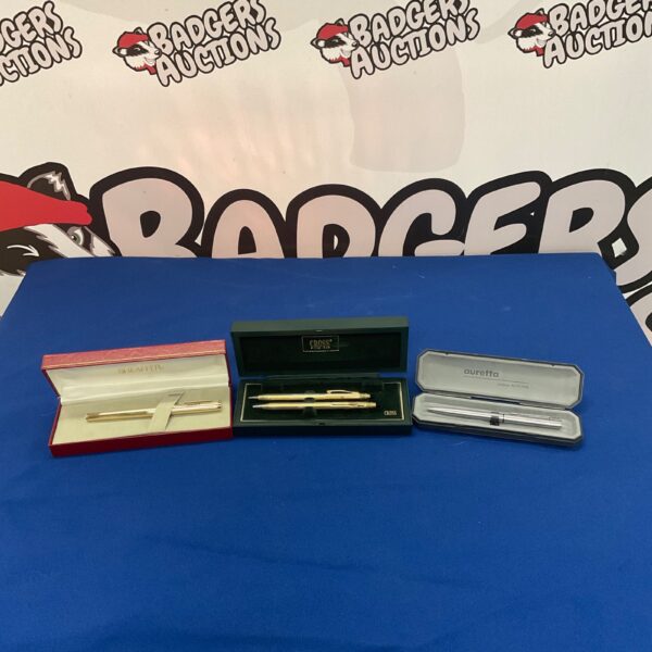 Vintage pen sets from Agusta, Cross, and Racal on display.