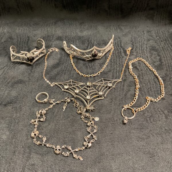 Alchemy pewter jewellery collection featuring tiaras and pendants.