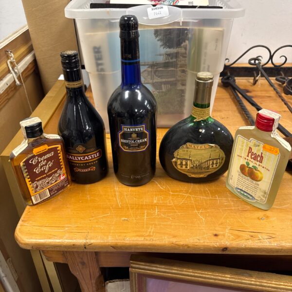 Mixed lot of alcohol bottles including Bristol Cream and peach schnapps.