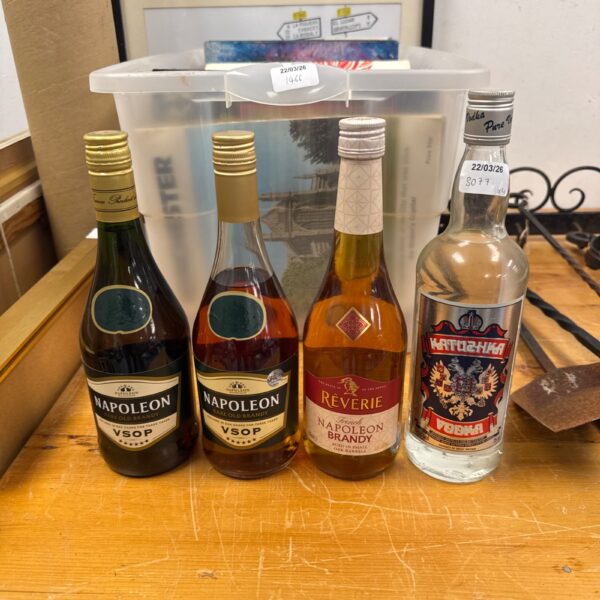 Mixed lot of alcohol bottles including brandy and vodka.