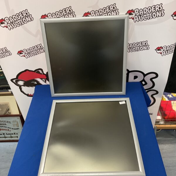 Silver aluminium poster frame for wall display.