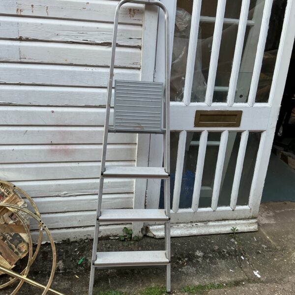 Vintage aluminium step ladder with three steps, ideal for home use.