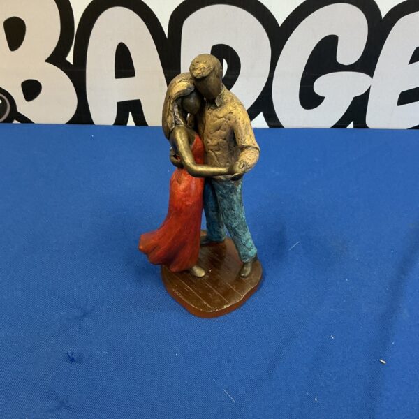 Detailed Amber Days dancing figurine of a couple in romantic pose.