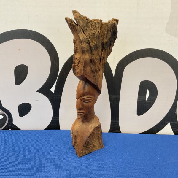 Antique African carved bust, detailed wood sculpture.