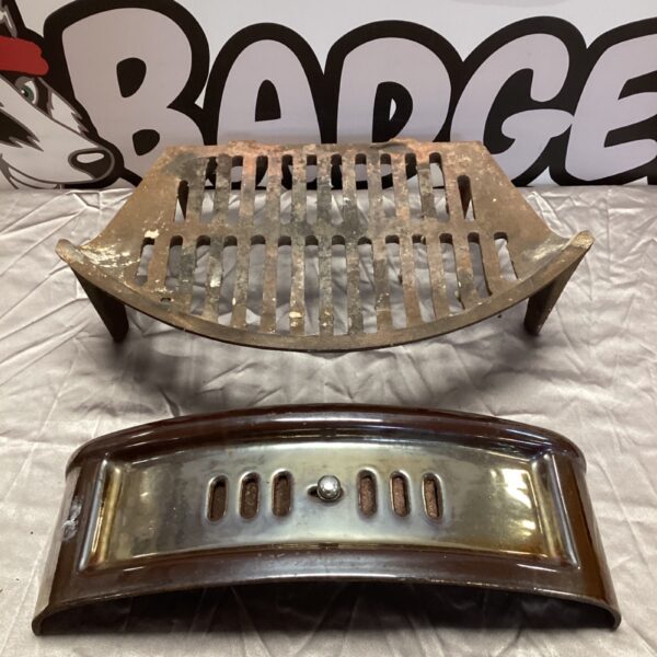 Antique cast iron fire grate with glazed fender for fireplace.