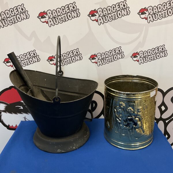 Antique coal scuttle and brass bin set for vintage fireplace decor.