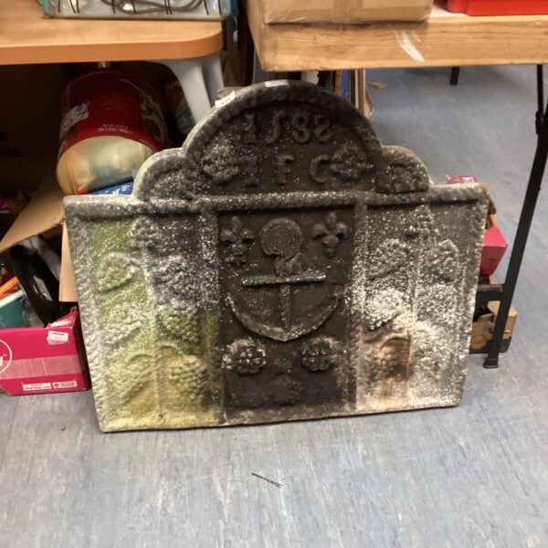 Antique Victorian fireplace tile with coat of arms design.