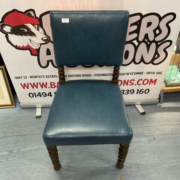 Antique mahogany chair with bobbin turned legs and a blue seat.