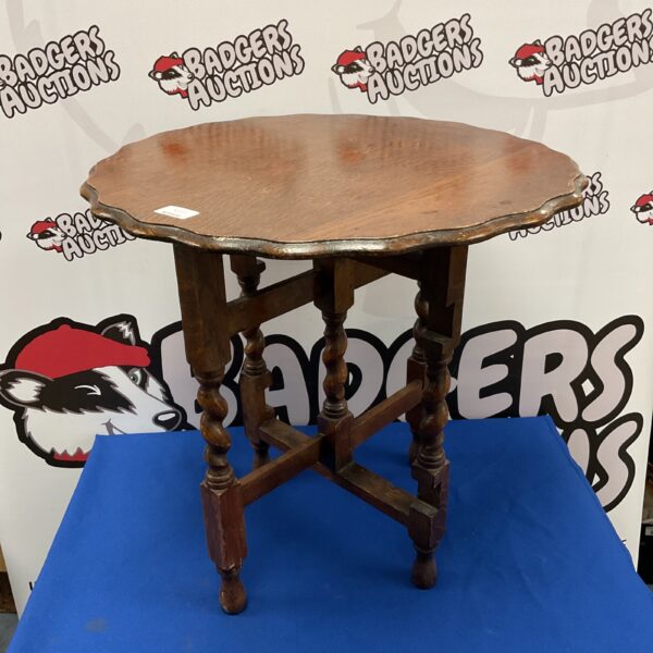 Antique oak folding table with barley twist legs.