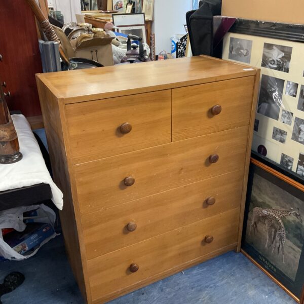 Antique pine chest of drawers with two over three configuration.