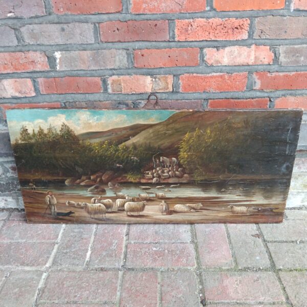 Antique oil painting of a river landscape with shepherds and sheep.