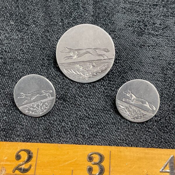 Set of three antique Scottish silver hunt buttons with fox design.