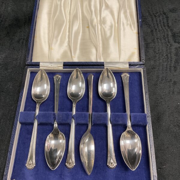 Antique silver plated grapefruit spoons in original velvet case.