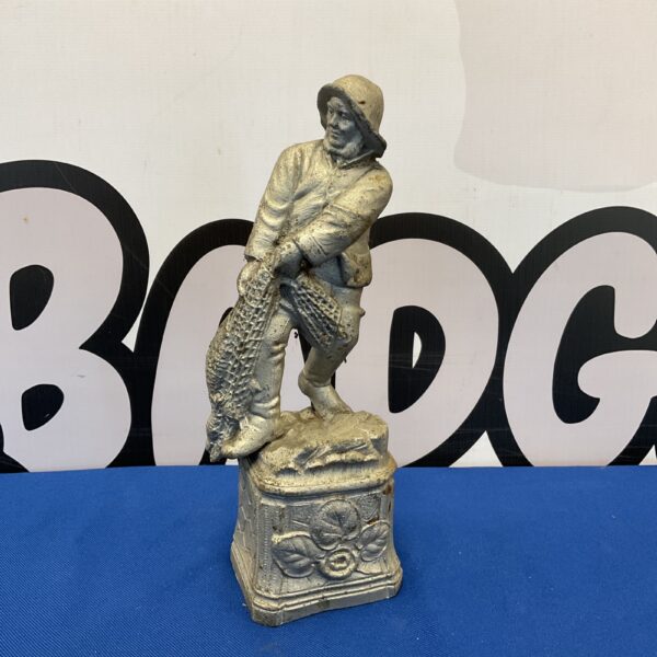 Antique spelter fisherman statue, detailed vintage metal figurine.