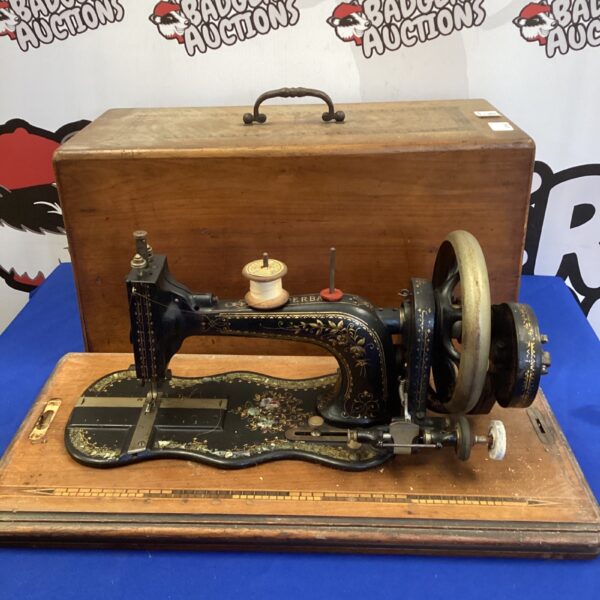 Antique Superba sewing machine with mother of pearl inlay detail.