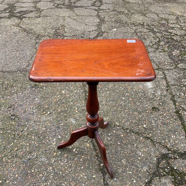Antique mahogany tripod lamp table with rectangular top.