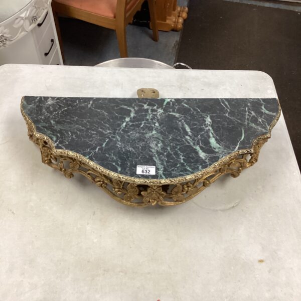 Antique wall mounted demi table with marble top and gilded frame.