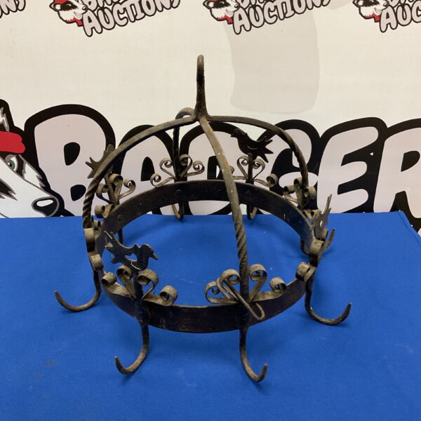 Antique wrought iron game hook with six hooks.