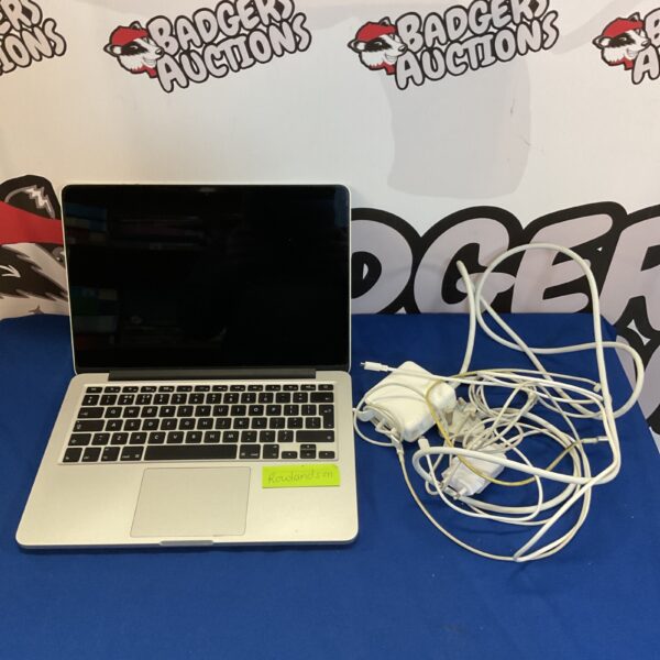 Silver Apple Macbook Pro A1502 laptop with charger.