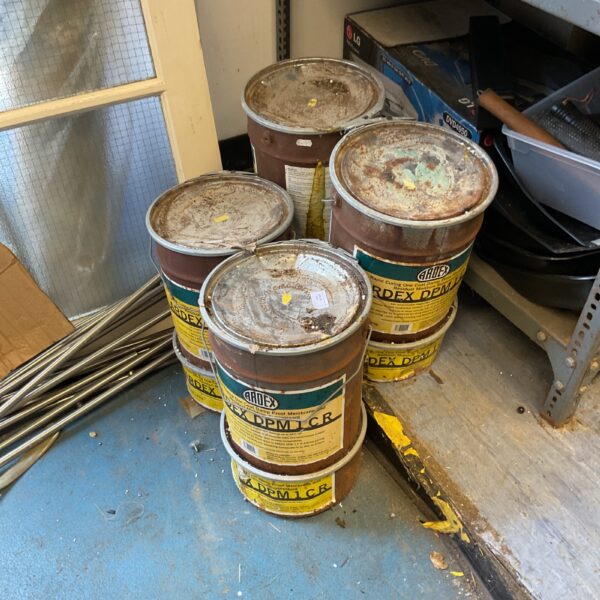 Four tubs of Ardex damp proofing coating for construction projects.