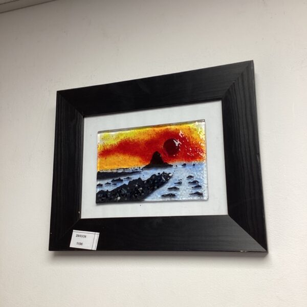 Vibrant art glass panel depicting a Black Rock coastal landscape.